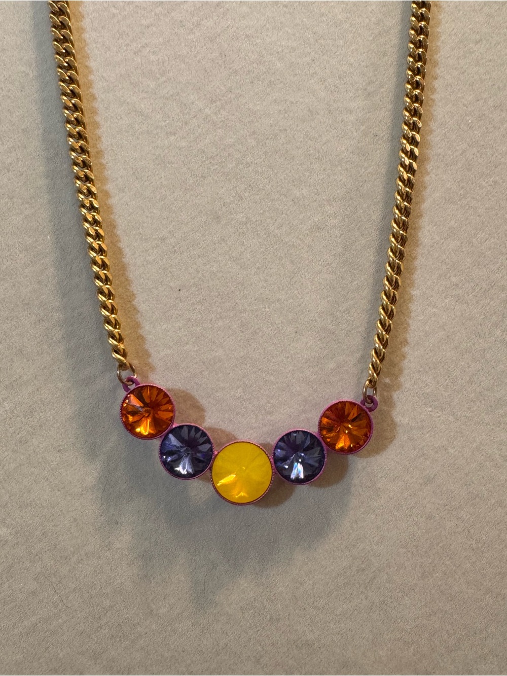 TOVA Gold Necklace with Yellow, Purple and Orange crystals w/ an enamel backing.